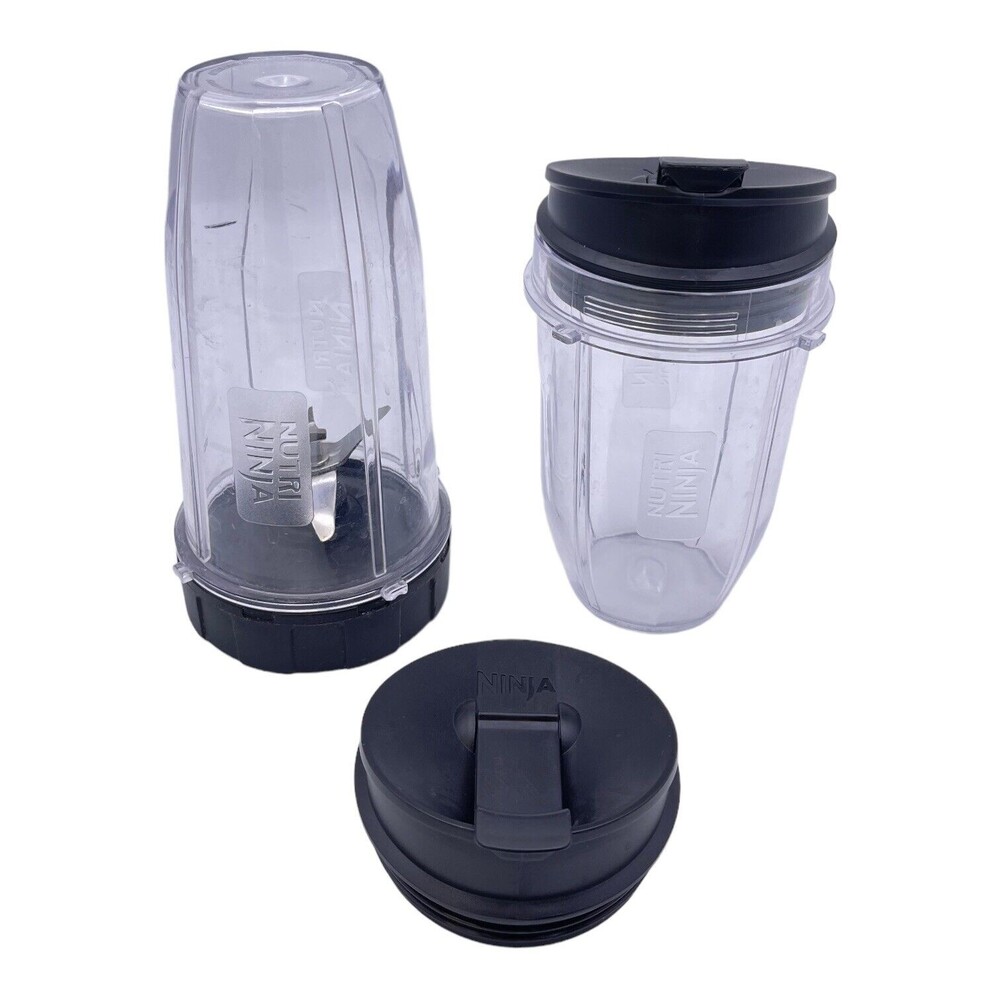 Nutri Ninja Lot 32oz 18oz Cups/Tumblers with Lids and one Extractor Blade